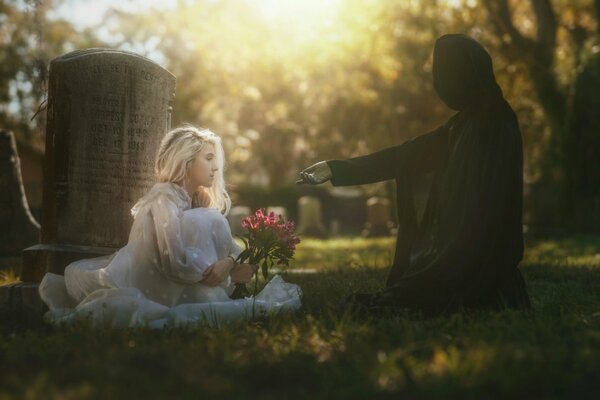 Ragazza in abito bianco al cimitero