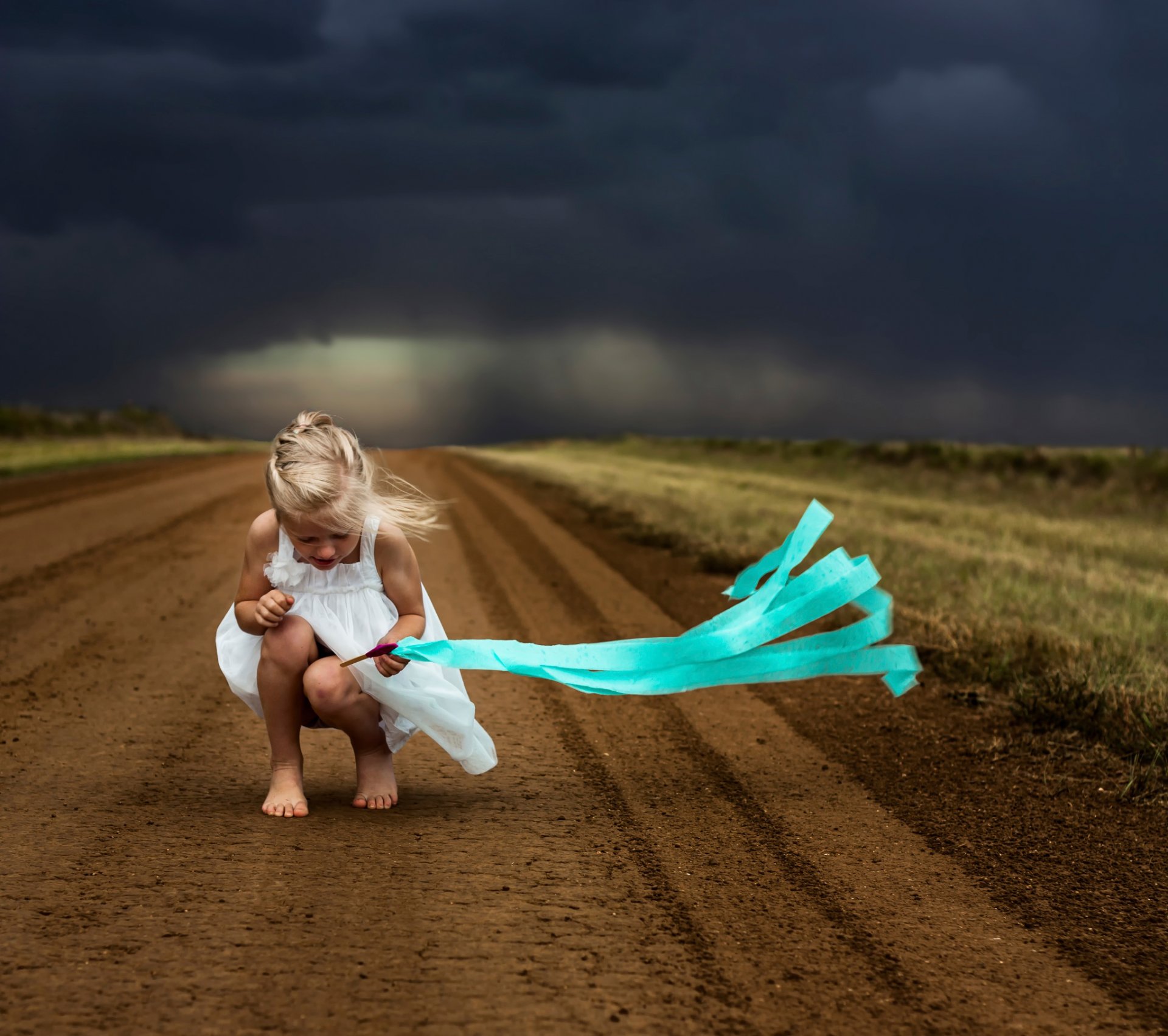 girl wind clouds road