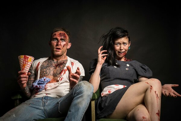 A guy and a girl in funny makeup like in a horror movie