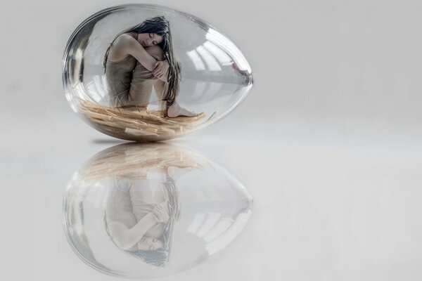 Reflection of a girl in a glass egg-girl