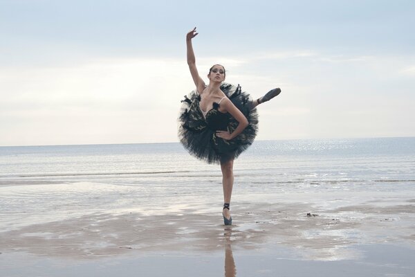 A ballerina girl dancing on the sea