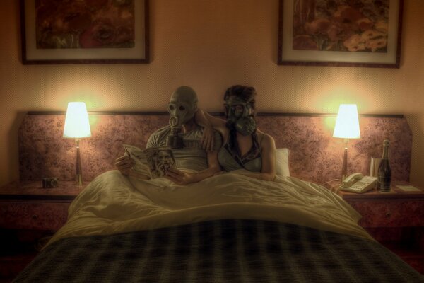 Life in gas masks. Couple in the bedroom