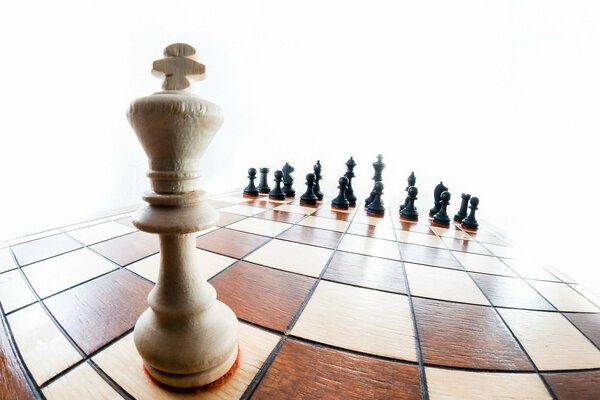 A chess queen on a board with other pieces