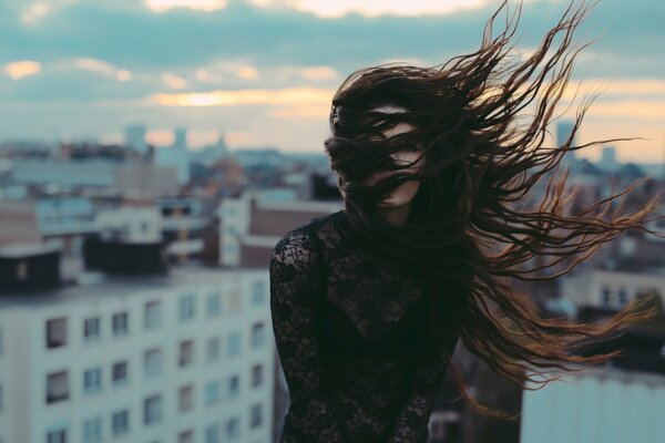 The wind blows through the girl s hair