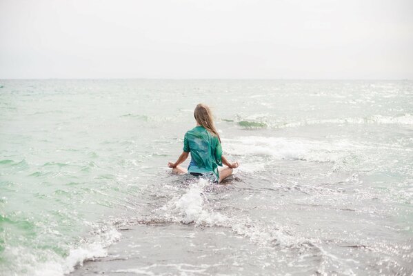 Blonde does yoga at sea