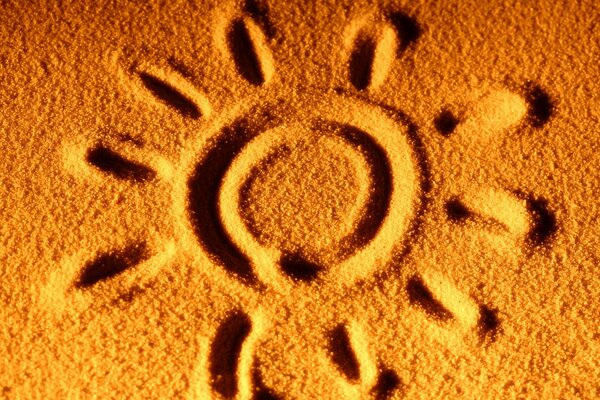 A cheerful sun painted on the sand