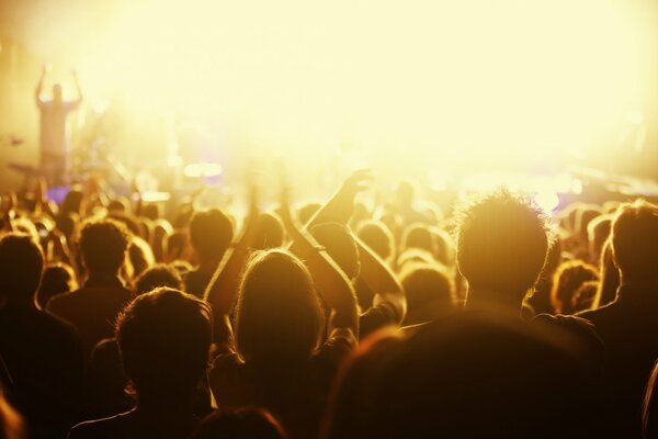 Concert hall with people in yellow glow