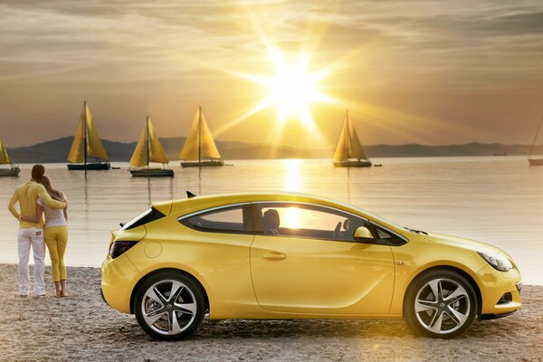 Stylish yellow on the beach by the car