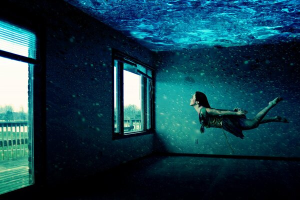 Chica flotando en la habitación a la ventana