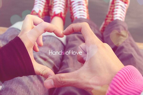 A couple in love shows their heart with their hands