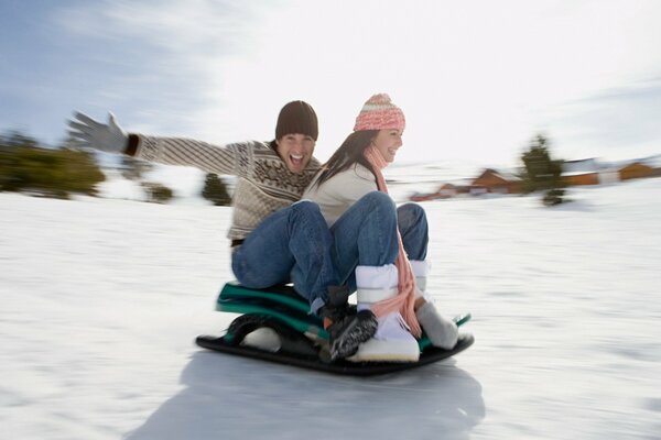 A guy and a girl are driving down the mountain