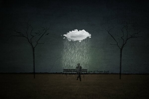 Smutny samotny człowiek w deszczu