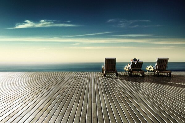 Relaxing on a sun lounger by the sea