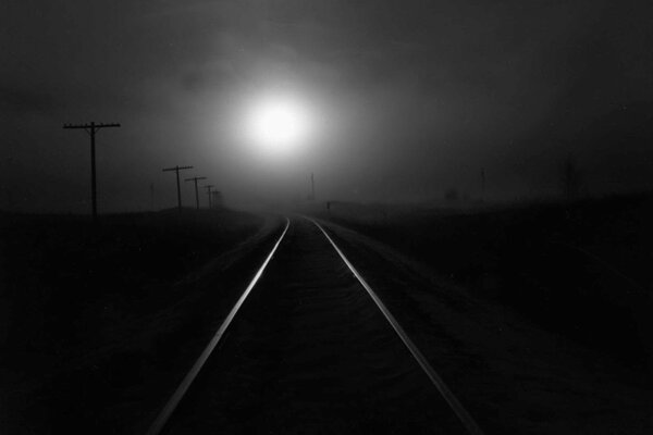 Railway in the dark under the moon