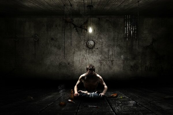 Samotny mężczyzna siedzi w ciemności