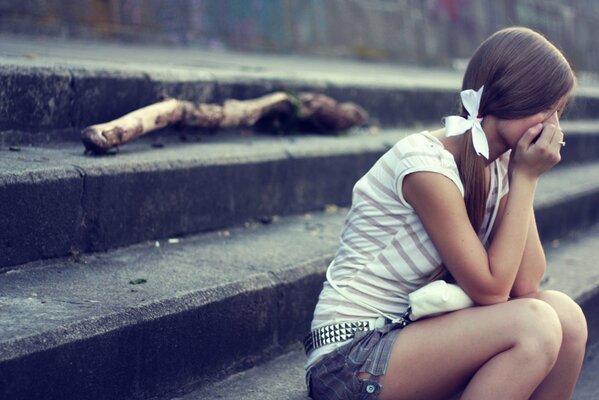 A girl bored on the steps