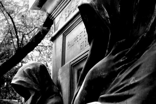 Statues at the entrance to the crypt. Black and white