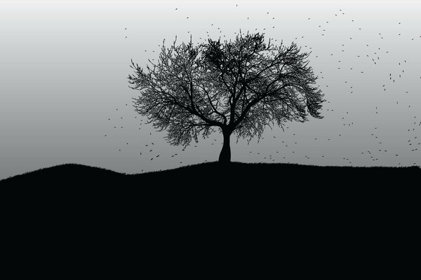 Black silhouette of a tree on a gray background