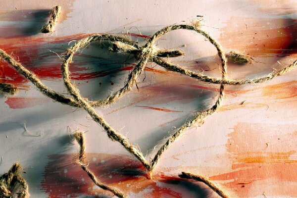 Photo by Zeek Barnaul with a knot of a whip in the form of a heart