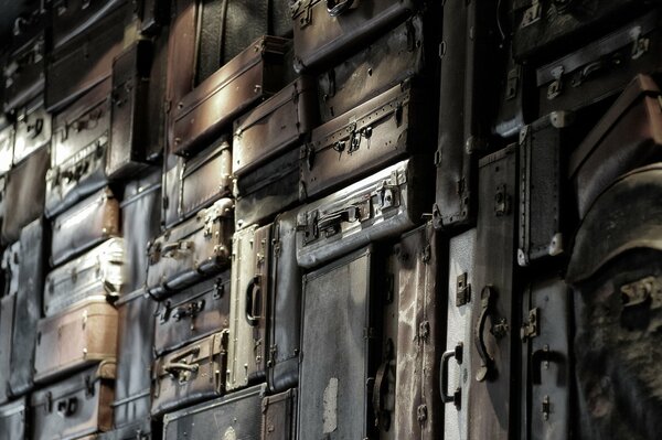 Background of a wall of old suitcases