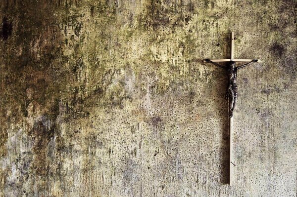 Catholic cross on a shabby wall