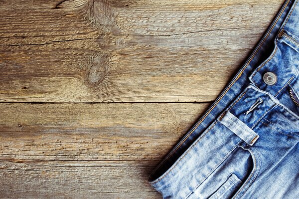 Blue jeans on a wooden table
