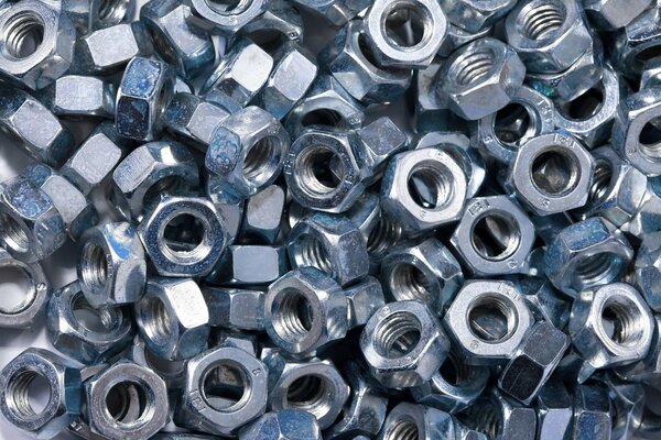 A large number of metal nuts