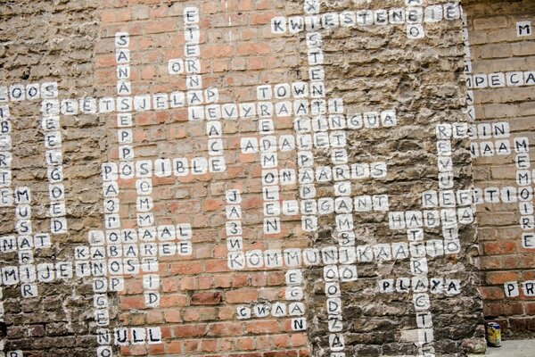 A brick wall with a crossword puzzle drawn on it