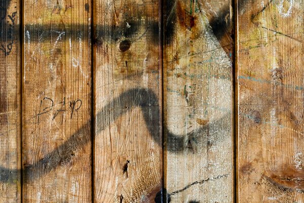 Wooden wall decorated with black paint