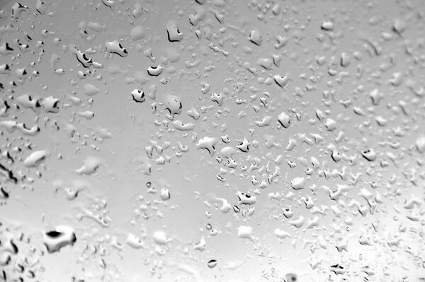 Water drops in the rain on the glass