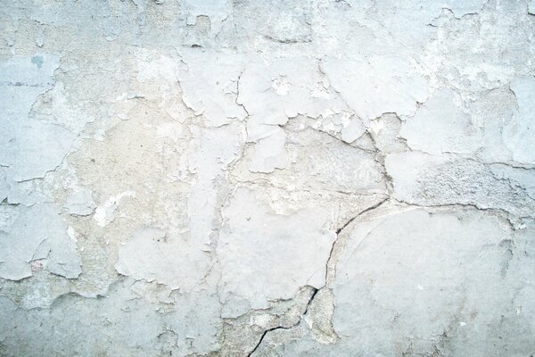 Textura de pintura descascarada sobre un fondo de pared gris