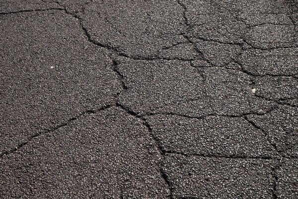 Cracks on the road covering asphalt