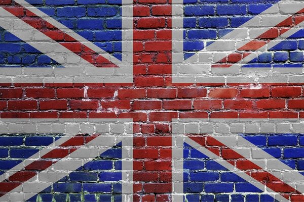 Bandera británica en una pared de ladrillo