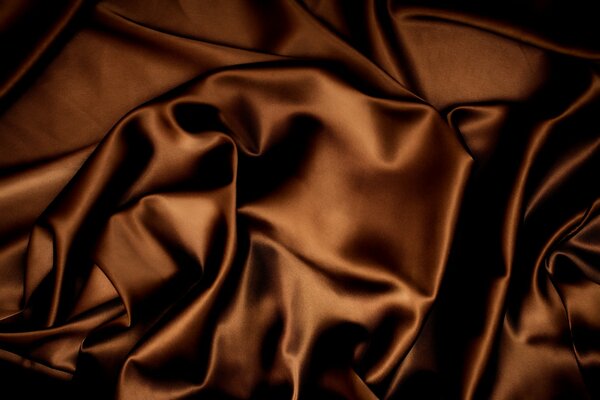 Chocolate silk. Brown fabric background