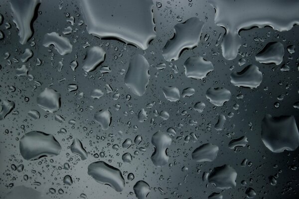 Water droplets on a gray surface background