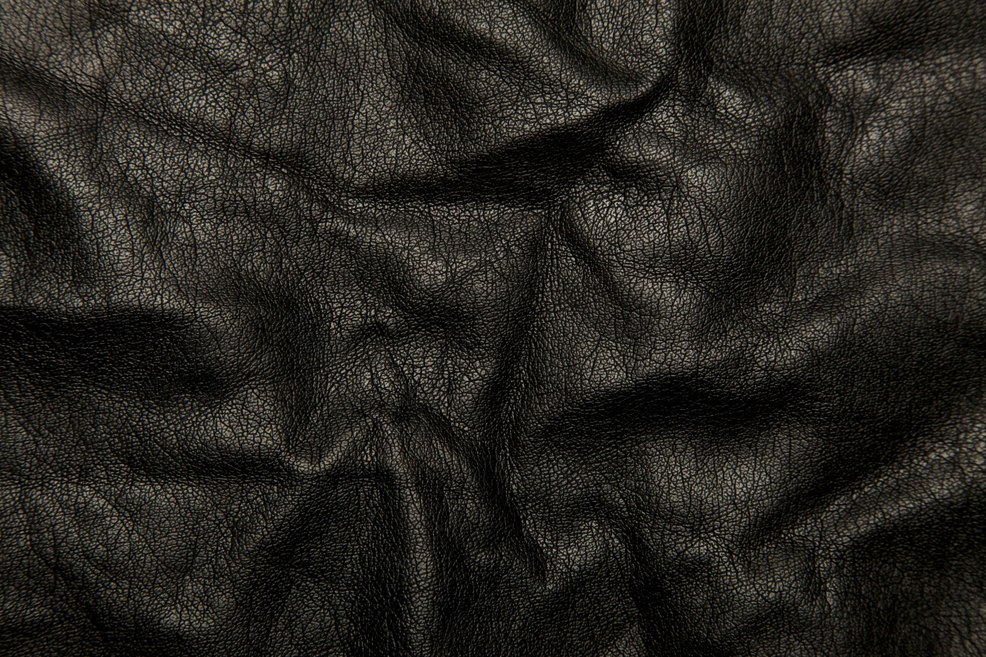 leder schwarz hintergrund textur falten risse