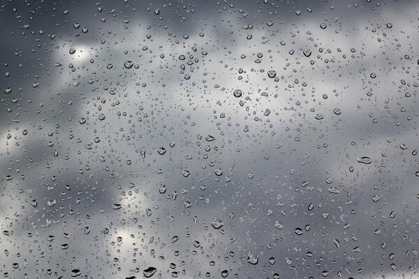 Glass with raindrops on its surface