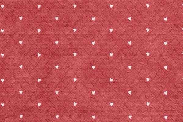 Sur fond rouge en forme de losange coeurs blancs