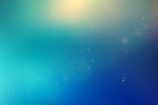 On a blue background, bubbles on the reflection of light