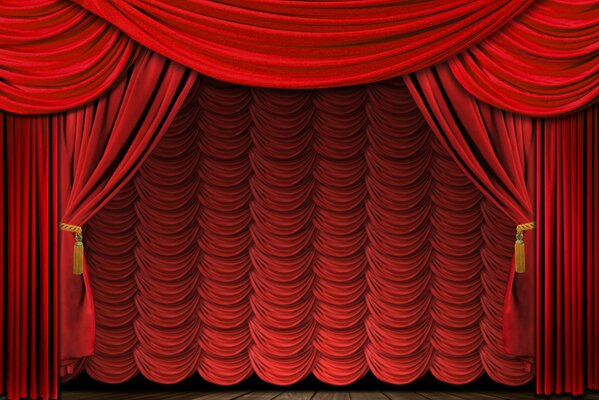 The rising red curtain on the stage
