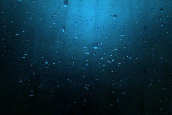 Texture of a raindrop on a dark background