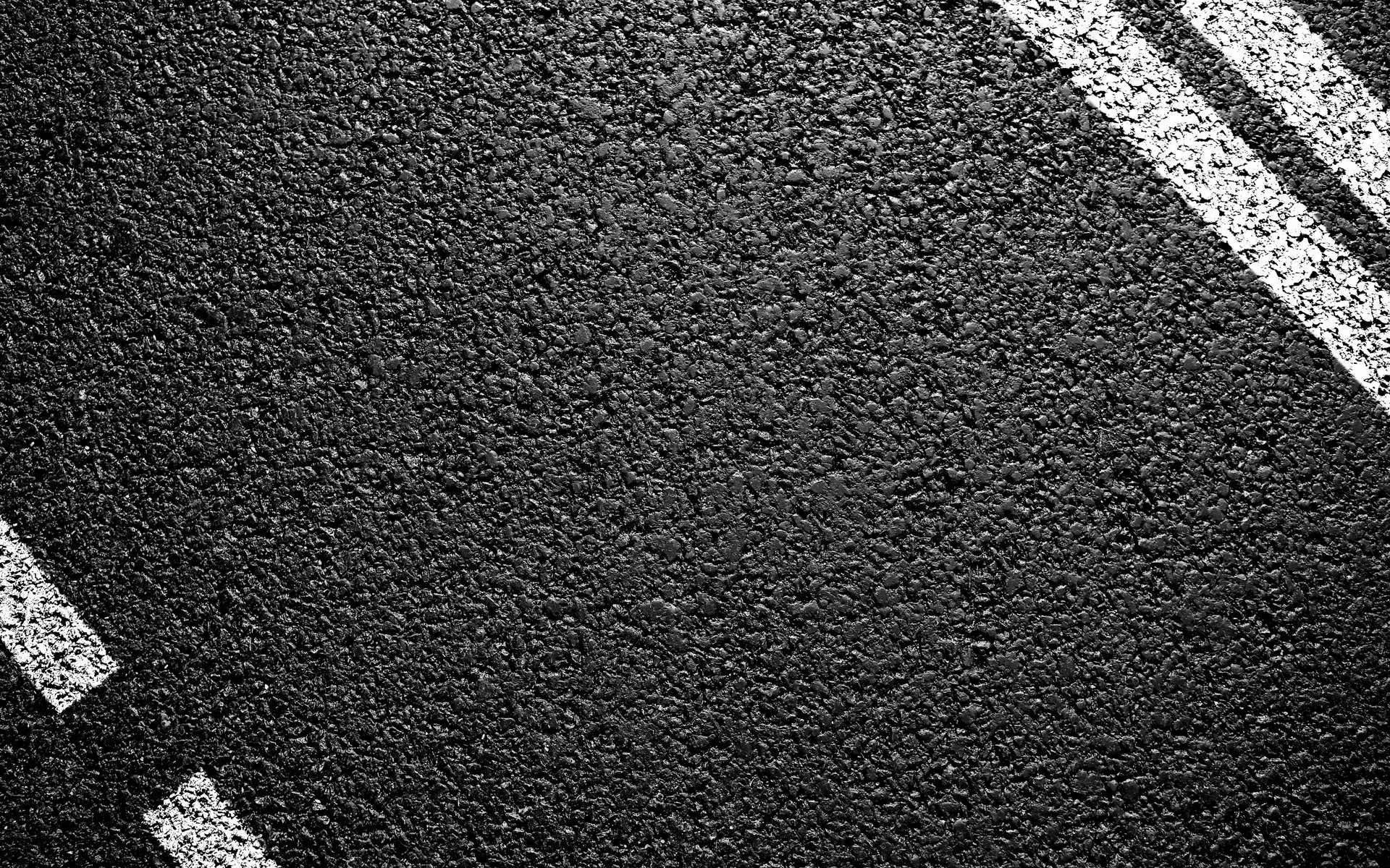 textures black background white stripes asphalt road counting close up