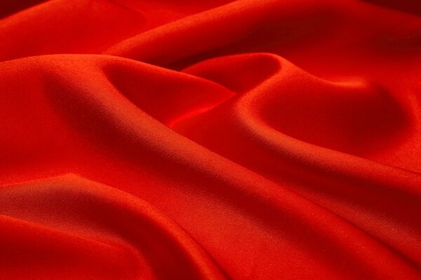 There are wavy folds on the red fabric