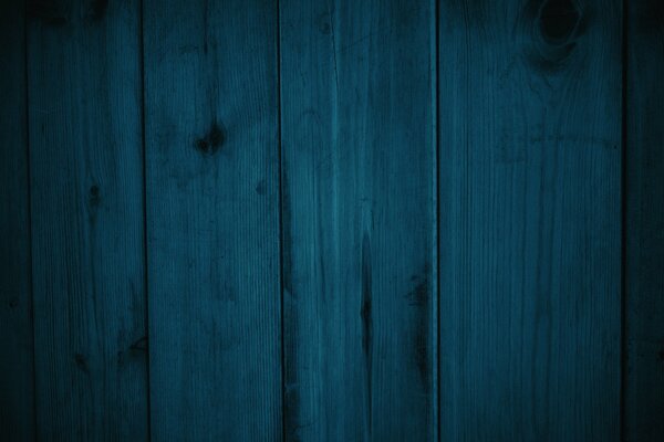 Background of blue, textured pieces of wood