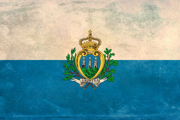 The flag of San Marino. White and blue background with coat of arms in the center