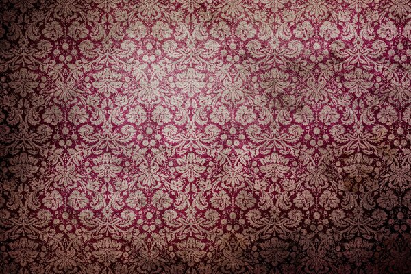 Papel pintado rosado en la pared con el patrón