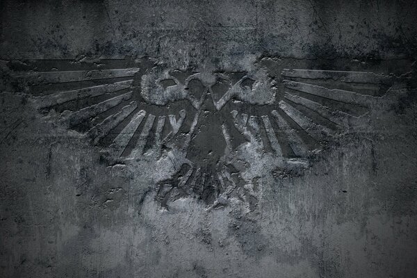 Eagle sign on concrete wall