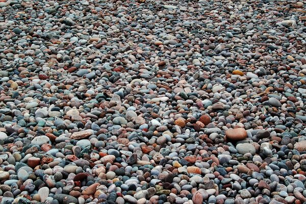 A lot of small stones on the beach in the village