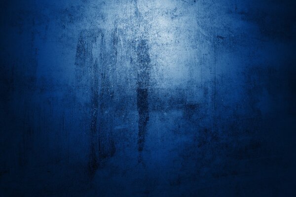 Blue background with black smudges