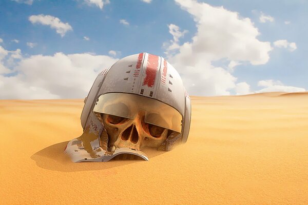 Helmet on the skull lying on the sand in the desert